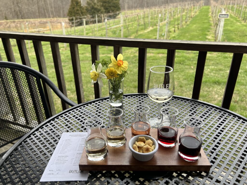 Wine Tasting flight with mini carafes on outdoor patio table